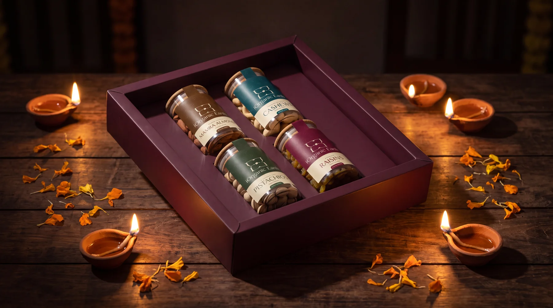 The Mayfair Mewa Box open on a wooden table surrounded by lit diyas and marigold petals